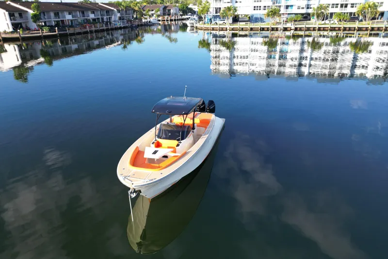 Slide: The Image of Lilybaeum Lipari 31 boat on calm water, reflecting waterfront buildings, 2026 model. - 8