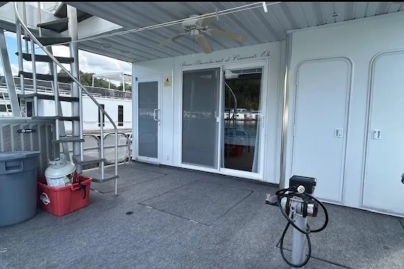 Slide: The Image of Houseboat deck with spiral staircase, sliding doors, and equipment; Sharpe 18 x 90, 2007 model. - 10