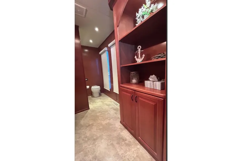 Slide: The Image of Luxurious 2007 Sharpe 18 x 90 houseboat interior with elegant wooden cabinetry and modern bathroom. - 12