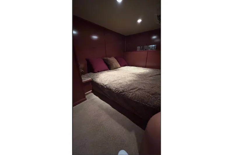 Slide: The Image of Cozy bedroom with plush bedding in a 2007 Sharpe 18 x 90 model. - 18