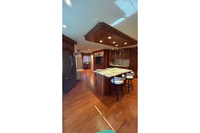 Slide: The Image of Luxurious kitchen interior in 2007 Sharpe 18 x 90 houseboat with island and bar stools. - 5