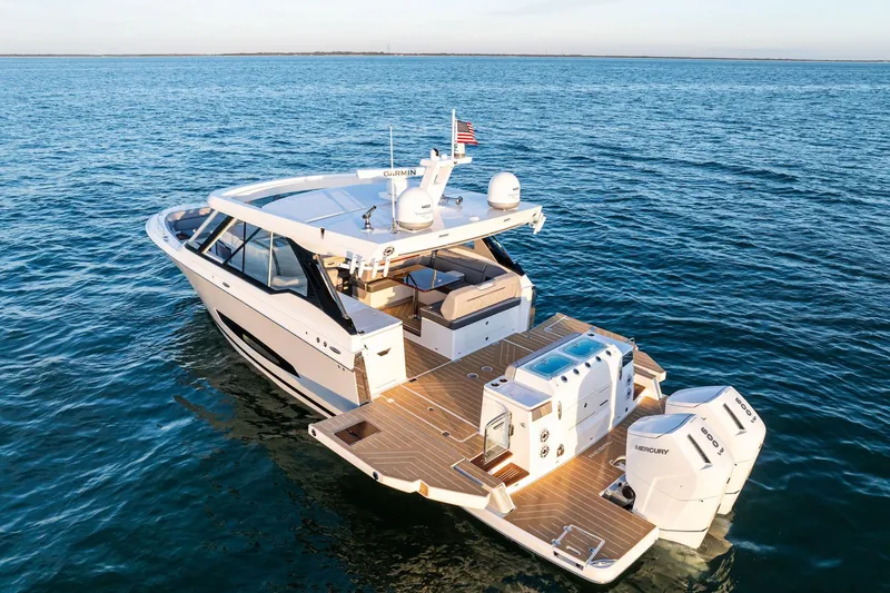 The Image of Luxurious 2026 Regal LX43 yacht cruising on open water, featuring sleek design and powerful engines. - 0