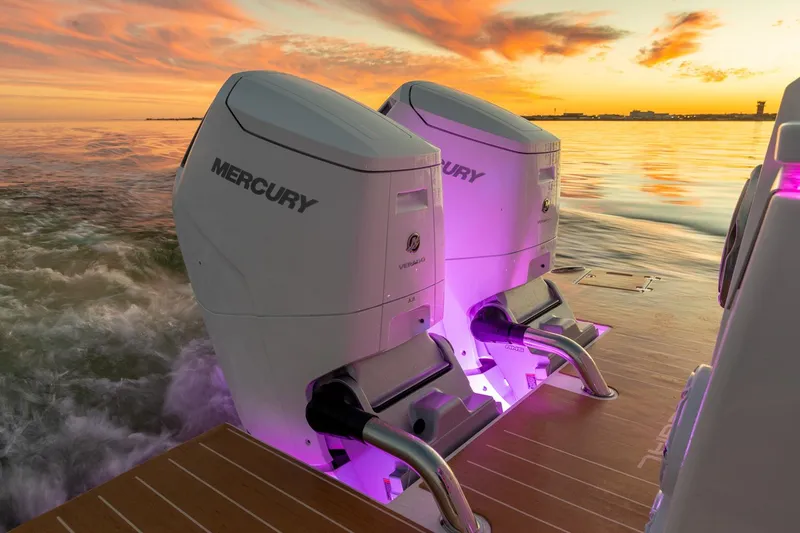 Slide: The Image of Twin Mercury outboard engines on Regal LX43 boat at sunset, 2026 model. - 10