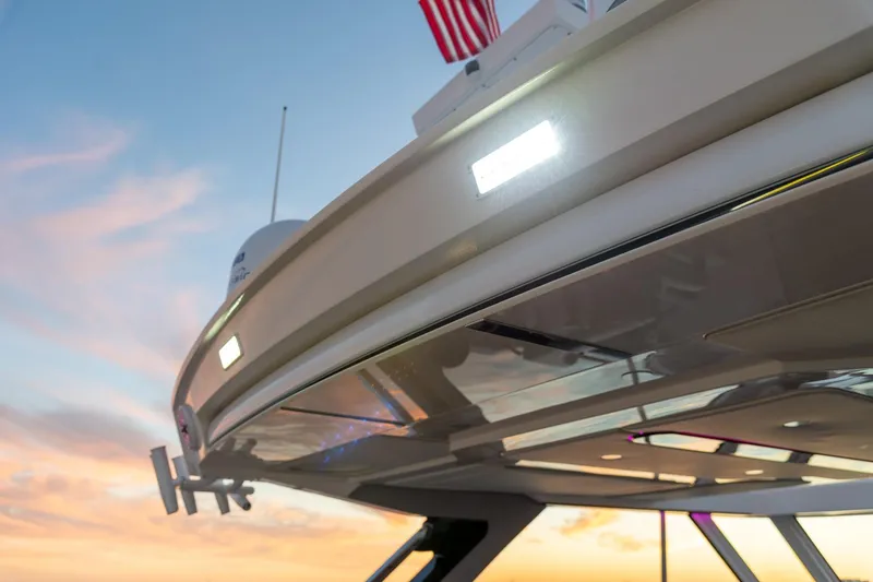 Slide: The Image of 2026 Regal LX43 yacht at sunset, showcasing sleek design and modern features. - 16