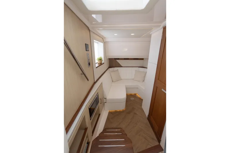 Slide: The Image of Luxurious interior of 2026 Regal LX43 yacht with modern seating and elegant wood finishes. - 23