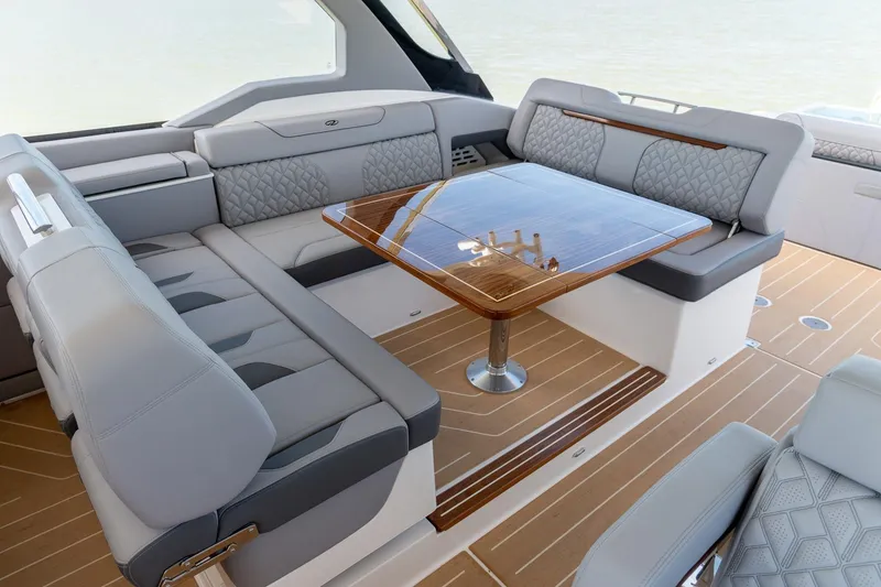 Slide: The Image of Luxurious interior of 2026 Regal LX43 yacht with elegant seating and wooden table. - 27