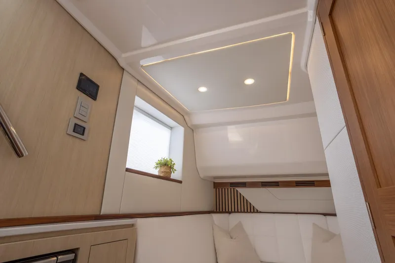 Slide: The Image of Luxurious interior of 2026 Regal LX43 yacht with modern lighting and elegant decor. - 34