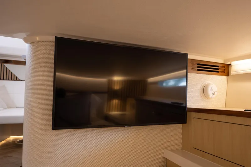 Slide: The Image of Flat-screen TV in the luxurious interior of a 2026 Regal LX43 yacht. - 35