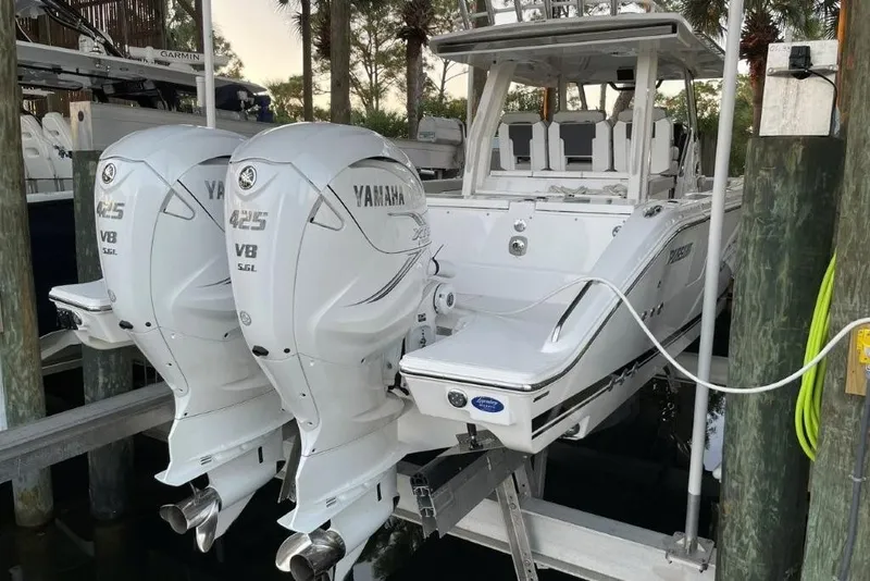 Slide: The Image of 2023 Pursuit S 358 Sport boat with twin Yamaha 425 V8 engines docked. - 14