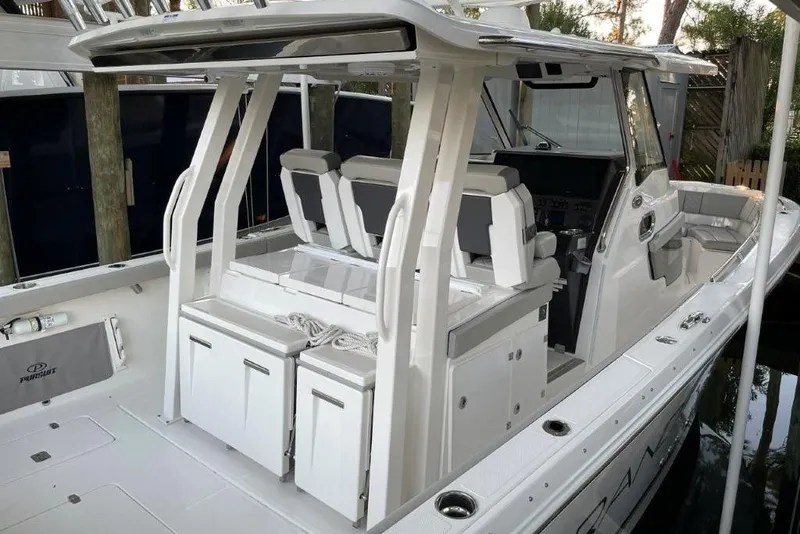 Slide: The Image of 2023 Pursuit S 358 Sport boat interior with seating and storage compartments. - 15