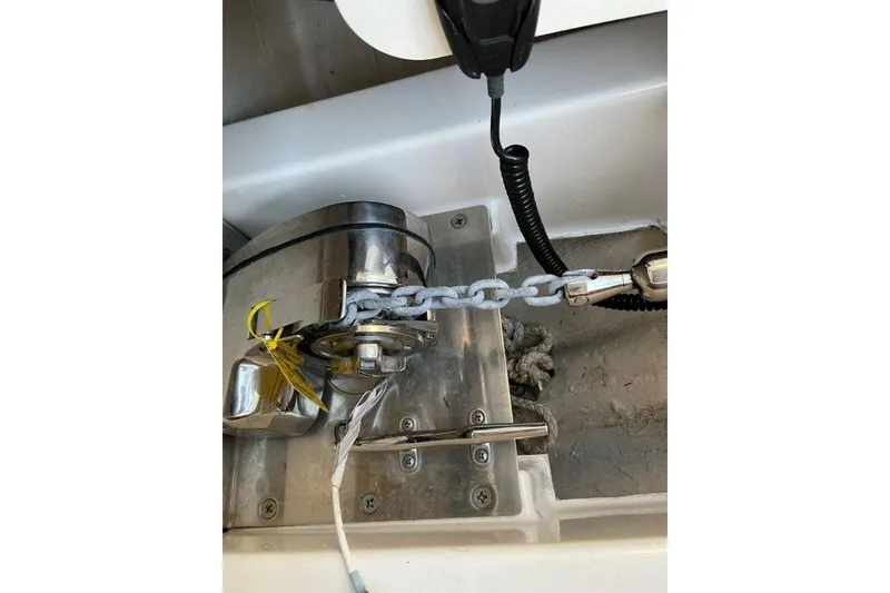 Slide: The Image of Anchor windlass system on 2023 Pursuit S 358 Sport boat, featuring chain and rope. - 21