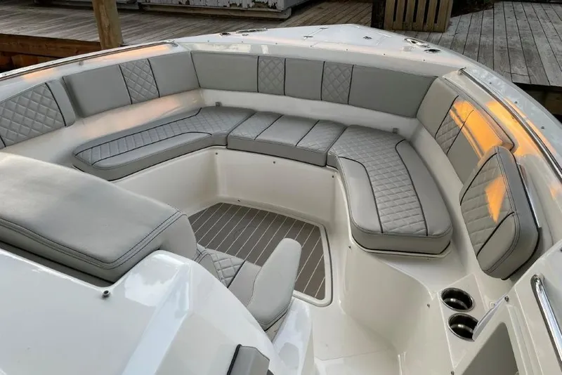 Slide: The Image of Luxurious seating area on 2023 Pursuit S 358 Sport boat, featuring elegant gray upholstery. - 5