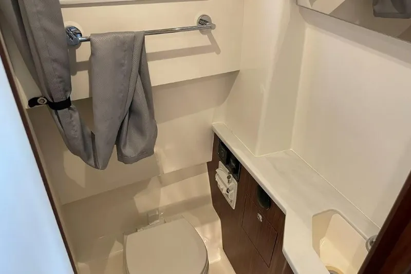 Slide: The Image of 2023 Pursuit S 358 Sport boat bathroom with modern fixtures and sleek design. - 8