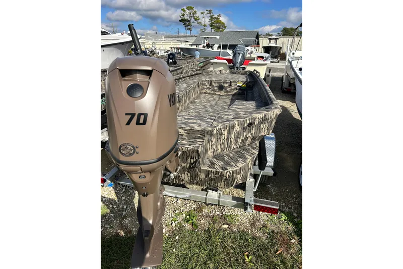 The Image of 2025 Havoc 1756 MRST boat with Yamaha 70 outboard motor, camo design, on trailer. - 0