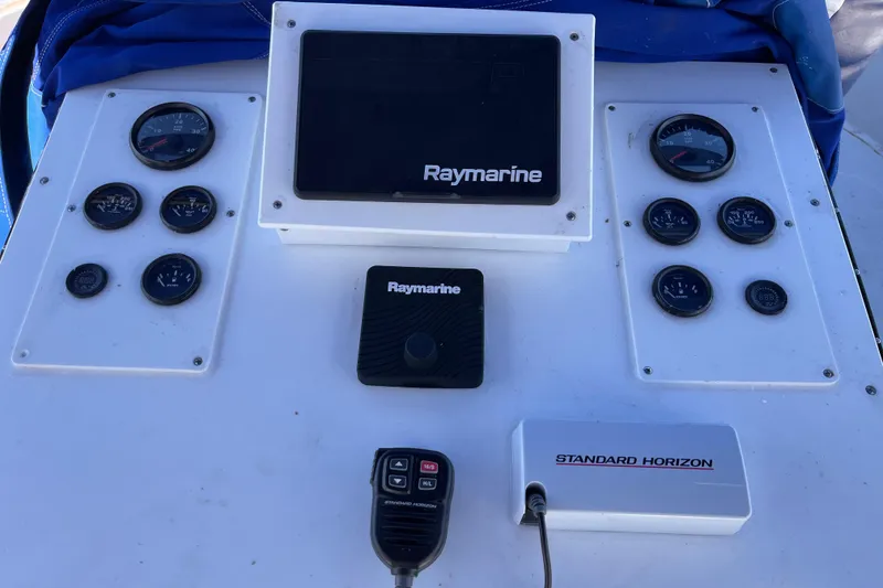 Slide: The Image of 1972 Whitcraft houseboat dashboard with Raymarine and Standard Horizon equipment. - 24