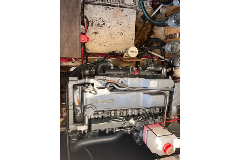 Slide: The Image of Engine compartment of a 1972 Whitcraft houseboat, featuring a 24-valve engine. - 28