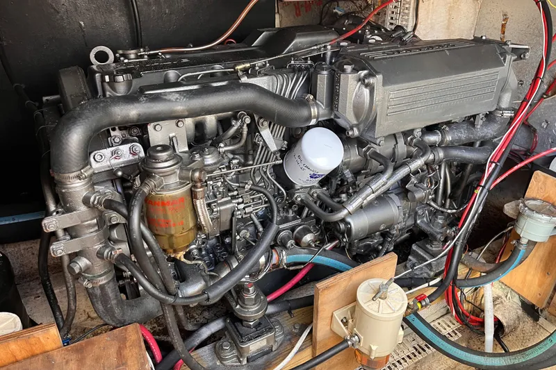 Slide: The Image of Engine of a 1972 Whitcraft houseboat, showcasing intricate mechanical components and wiring. - 29