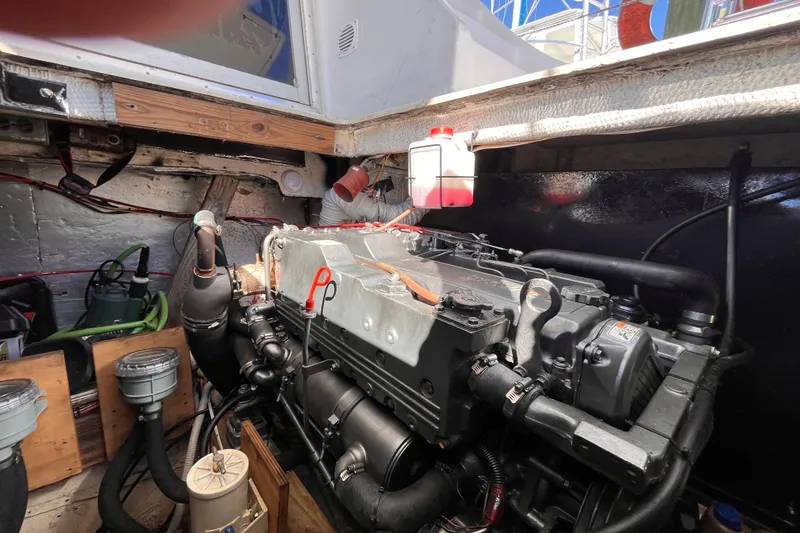 Slide: The Image of 1972 Whitcraft houseboat engine room with visible machinery and components. - 30