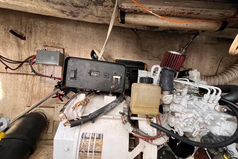 Slide: The Image of 1972 Whitcraft houseboat engine compartment with wiring and mechanical components. - 33