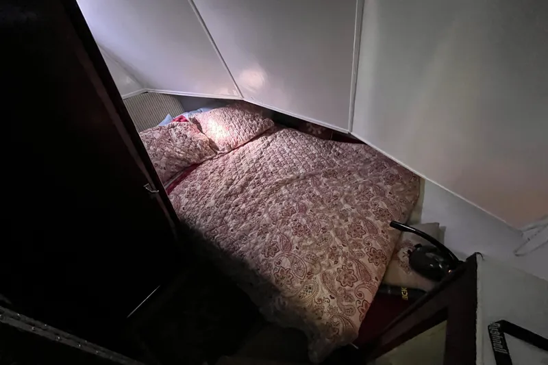 Slide: The Image of Cozy bedroom in a 1972 Whitcraft houseboat with floral bedding. - 8