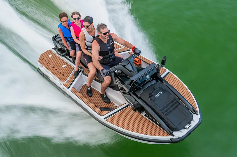 Slide: The Image of Manufacturer Provided Image: 2026 Yamaha WaveRunner Crosswave with four riders speeding on water. - 5