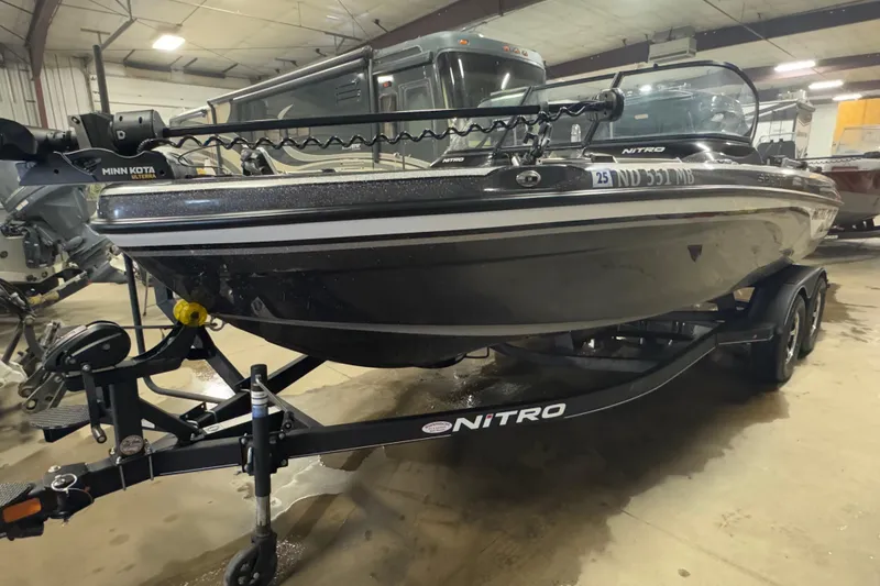 Slide: The Image of 2024 Nitro ZV19 Sport boat on trailer in indoor storage facility. - 1