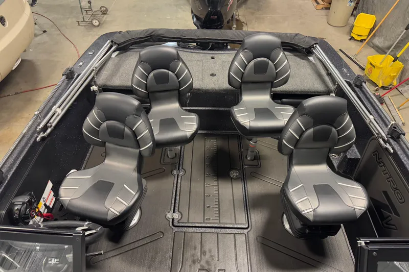 Slide: The Image of 2024 Nitro ZV19 Sport boat interior with four sleek, black seats in a spacious layout. - 11