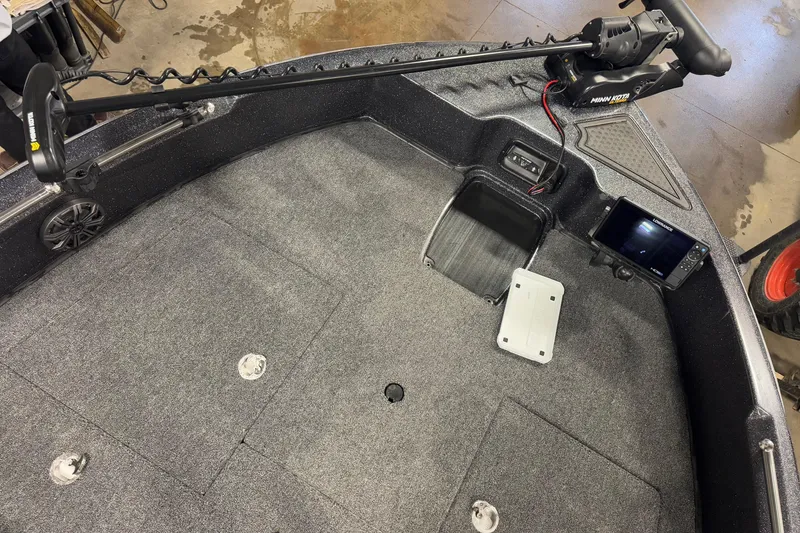 Slide: The Image of 2024 Nitro ZV19 Sport boat deck with trolling motor and fish finder. - 14