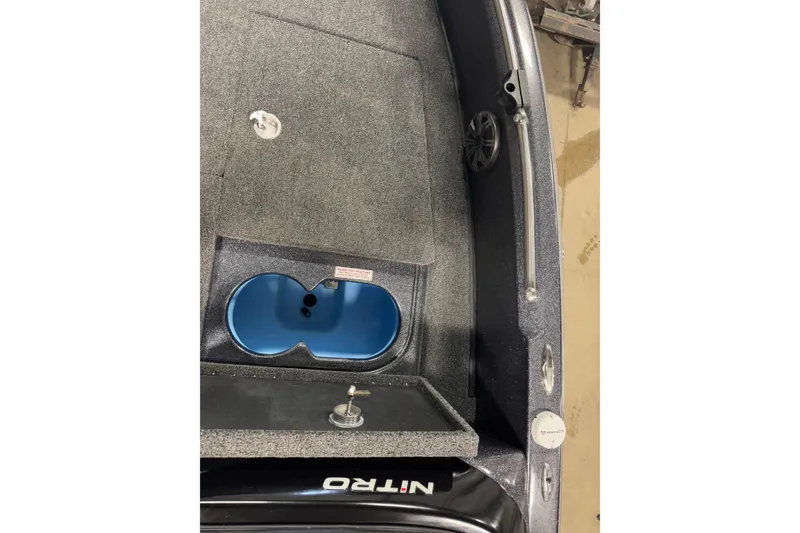 Slide: The Image of 2024 Nitro ZV19 Sport boat interior with storage compartment and speaker. - 17
