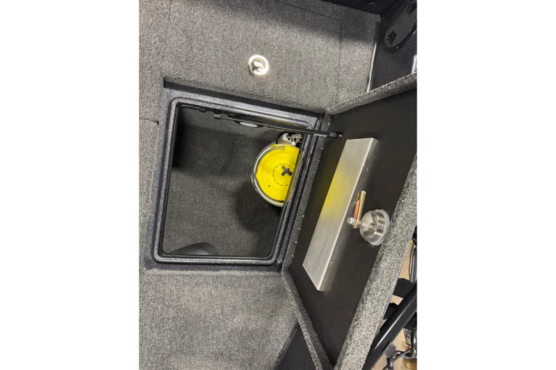 Slide: The Image of 2024 Nitro ZV19 Sport boat storage compartment with yellow safety equipment. - 19