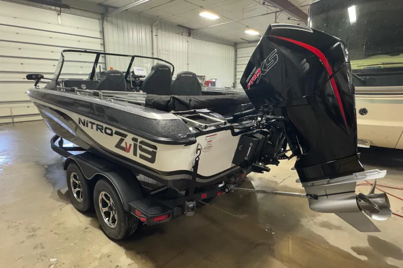 Slide: The Image of 2024 Nitro ZV19 Sport boat with powerful engine in indoor storage facility. - 4