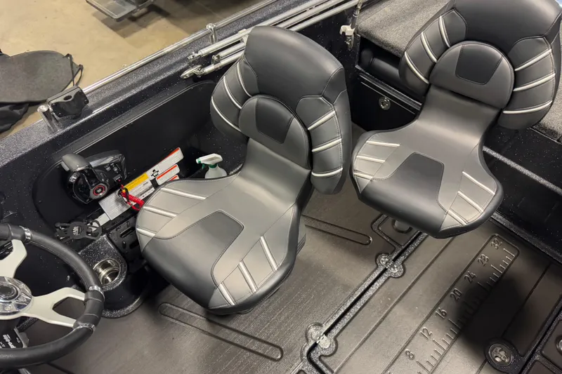 Slide: The Image of 2024 Nitro ZV19 Sport boat interior with sleek, modern seating and steering wheel. - 7
