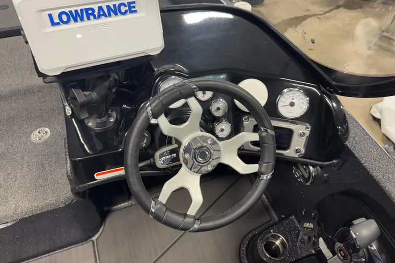 Slide: The Image of 2024 Nitro ZV19 Sport dashboard with steering wheel and Lowrance HDS display. - 9