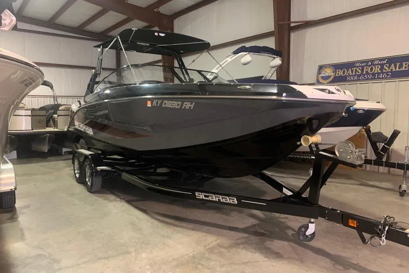 The Image of 2019 Scarab 255 Wake ID boat on trailer in showroom for sale. - 0