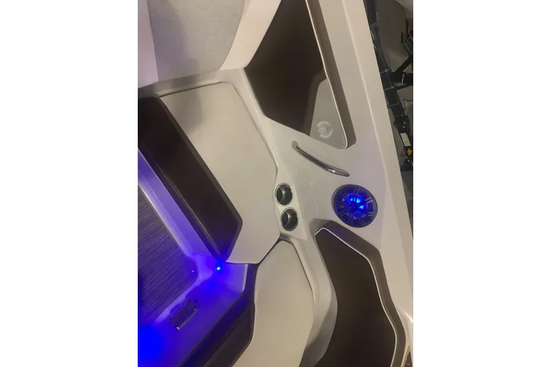 Slide: The Image of Interior of 2019 Scarab 255 Wake ID boat with blue LED lighting and speaker. - 12