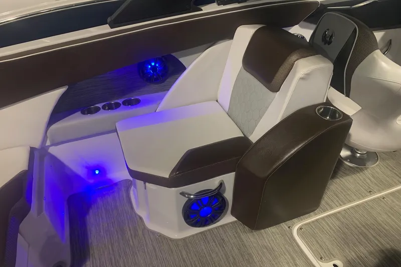 Slide: The Image of Luxurious interior of 2019 Scarab 255 Wake ID boat with illuminated seating and cup holders. - 13