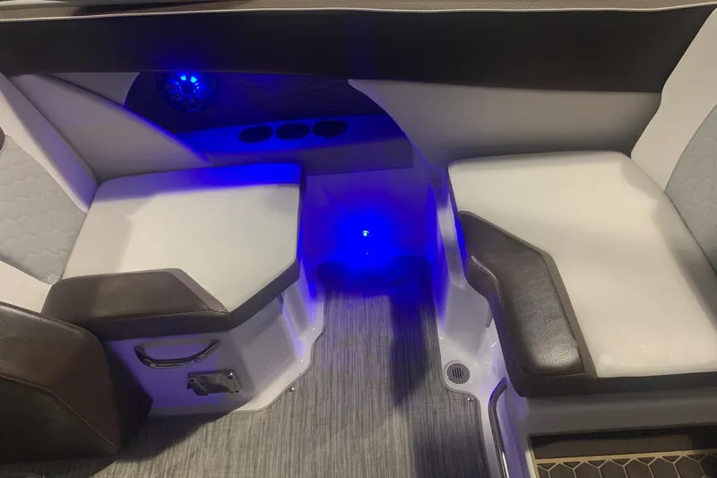 Slide: The Image of Interior seating of 2019 Scarab 255 Wake ID boat with blue LED lighting. - 14
