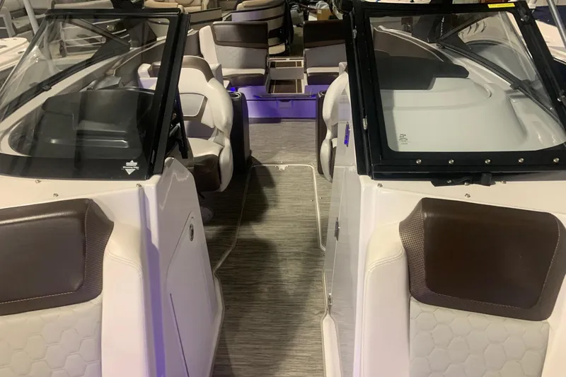 Slide: The Image of 2019 Scarab 255 Wake ID boat interior with dual consoles and seating. - 16