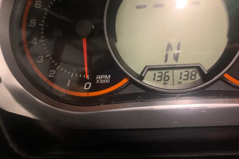 Slide: The Image of Close-up of 2019 Scarab 255 Wake ID dashboard showing RPM gauge and digital display. - 20