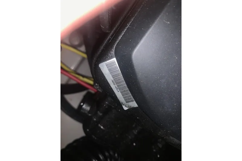 Slide: The Image of Close-up of a 2019 Scarab 255 Wake ID engine component with visible barcode. - 29