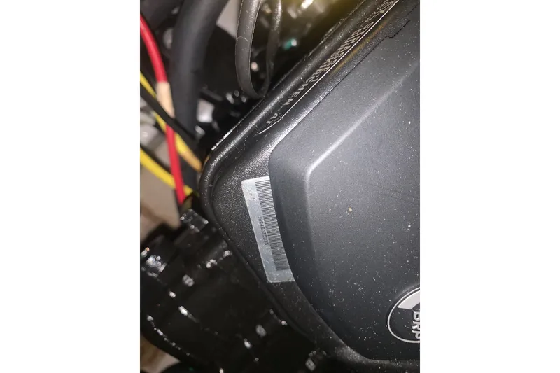 Slide: The Image of Close-up of 2019 Scarab 255 Wake ID engine components with visible wiring. - 30