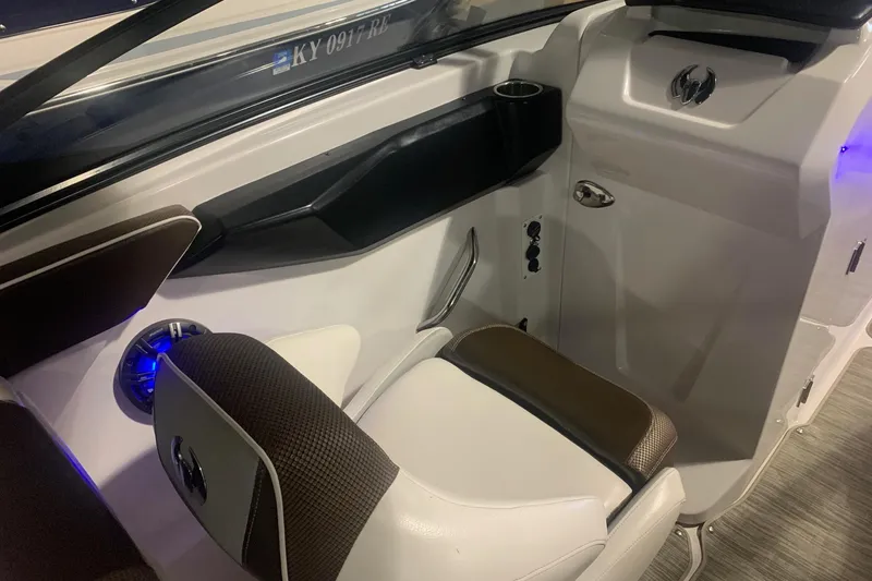 Slide: The Image of 2019 Scarab 255 Wake ID boat interior with seating and control panel. - 5