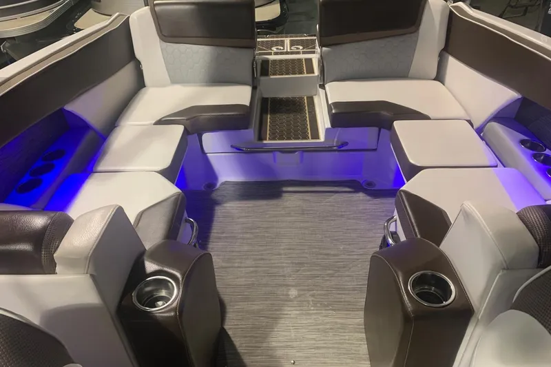 Slide: The Image of Luxurious interior of 2019 Scarab 255 Wake ID boat with ambient blue lighting. - 6