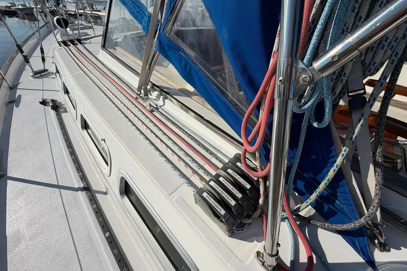 Slide: The Image of Deck of 2004 Beneteau 57 sailboat with ropes and winches. - 28