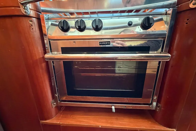 Slide: The Image of Stainless steel oven in 2004 Beneteau 57 yacht kitchen. - 51