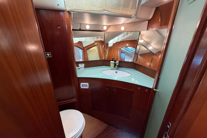Slide: The Image of Luxurious bathroom interior of 2004 Beneteau 57 yacht with wood finish and modern amenities. - 60