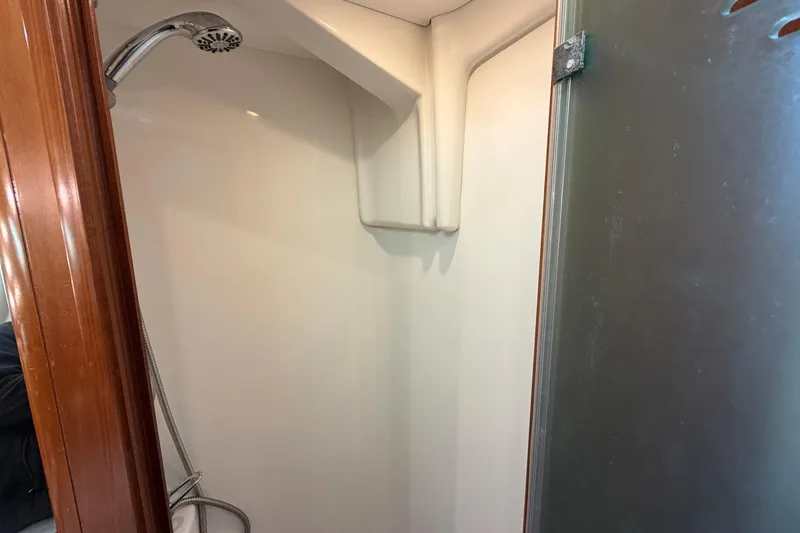 Slide: The Image of Shower area inside a 2004 Beneteau 57 yacht, featuring a sleek design. - 61