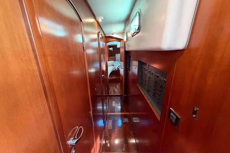 Slide: The Image of Luxurious wooden interior hallway of a 2004 Beneteau 57 yacht. - 62