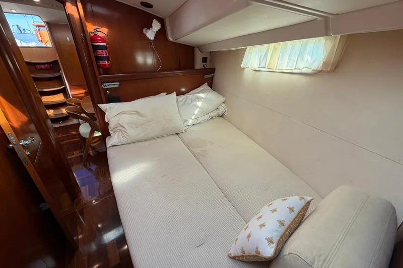 Slide: The Image of Luxurious cabin interior of a 2004 Beneteau 57 yacht with cozy bedding. - 65