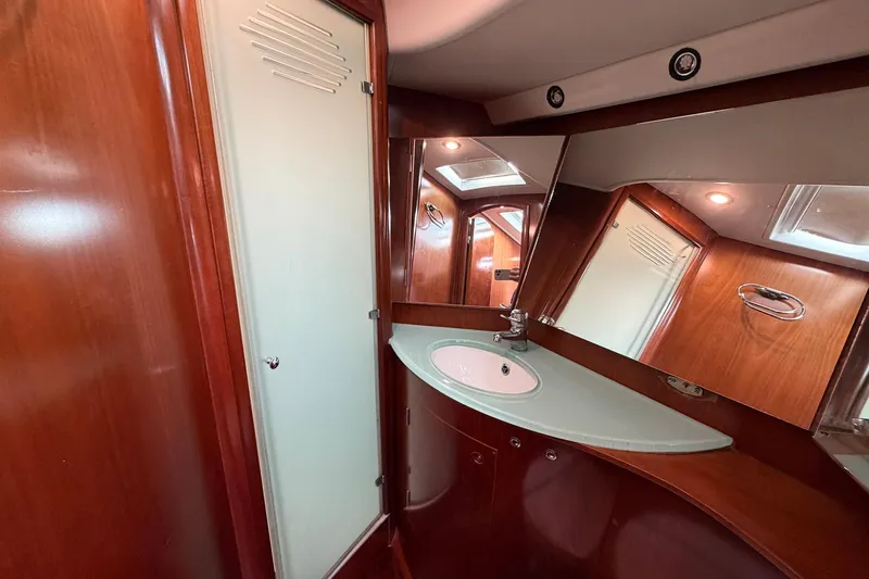 Slide: The Image of Luxurious bathroom interior of 2004 Beneteau 57 yacht with wood finish and modern fixtures. - 71
